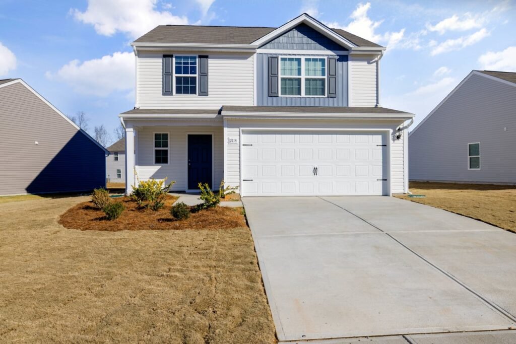 White and Blue House Under Blue Sky fix by Garage Door Repair Marysville, WA